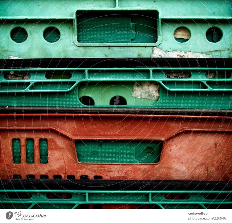 breadbox monkey Plastic Old Green Red Geometry Second-hand Colour photo Abstract Structures and shapes Contrast Plastic packaging Plastic box Plastic world