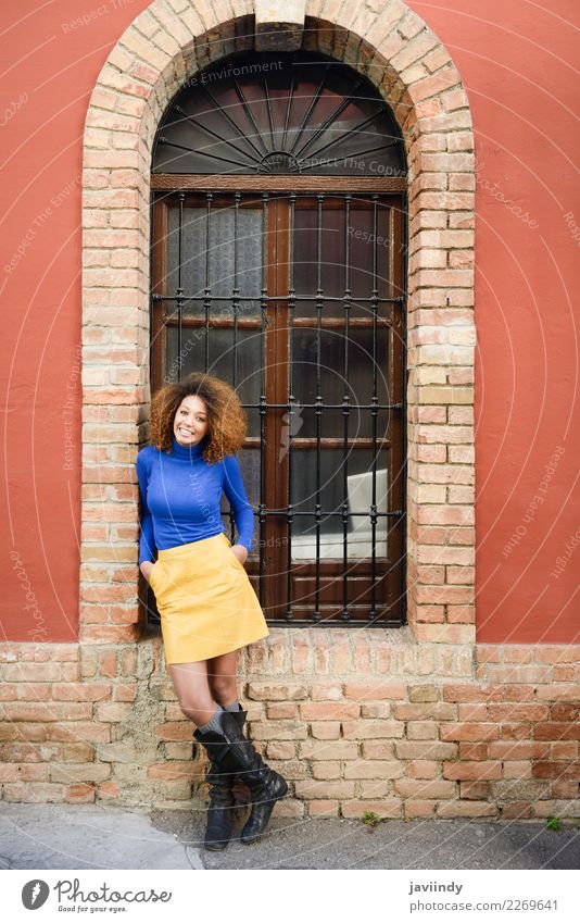 Smiling black woman, afro hairstyle, agains urban wall. Lifestyle Elegant Style Beautiful Hair and hairstyles Human being Feminine Young woman