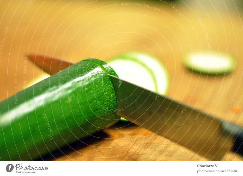 Potato in panic fear of a sharp armor knife - a Royalty Free Stock Photo  from Photocase