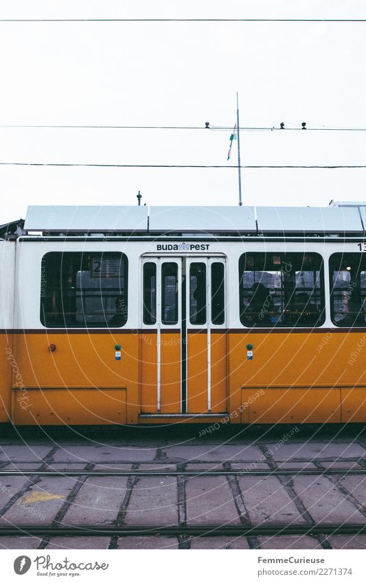 Tram in Budapest Transport Means of transport Passenger traffic Public transit Rush hour Road traffic Train travel Yellow Railroad tracks Hungary Overhead line