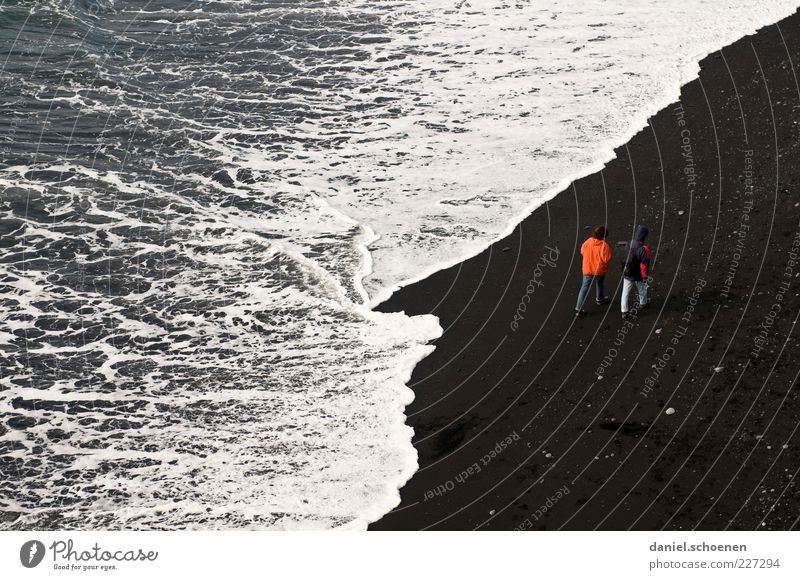 beach walk Vacation & Travel Tourism Beach Ocean Waves Masculine Couple Partner 2 Human being Coast Red Black White Together Relationship Iceland Lava beach