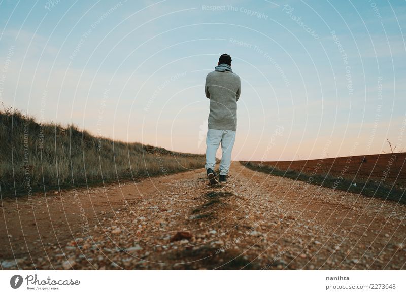 Back view of a man walking along a rural path Lifestyle Healthy Health care Wellness Harmonious Senses Relaxation Human being Masculine Man Adults 1