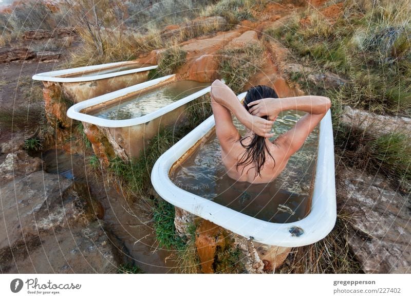 Young woman relaxing in a natural hot springs.. Lifestyle Beautiful Personal hygiene Well-being Relaxation Spa Swimming & Bathing Bathtub Youth (Young adults) 1