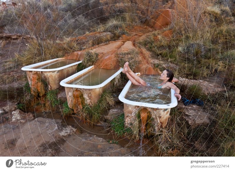 Young woman relaxing in a natural hot springs.. Well-being Relaxation Spa Bathtub Youth (Young adults) 1 Human being 18 - 30 years Adults Swimming & Bathing Wet