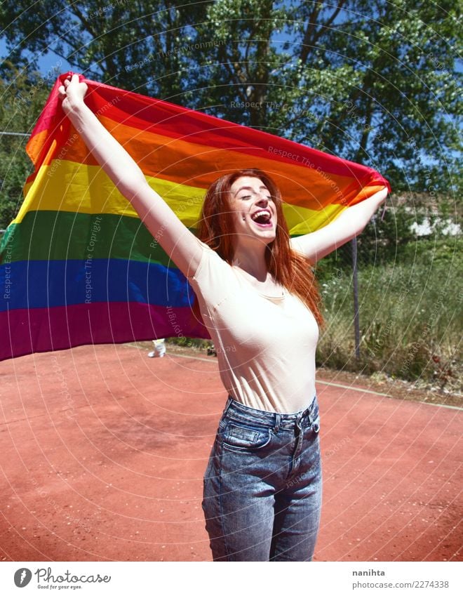Young woman holding a rainbow flag Lifestyle Style Joy Wellness Well-being Feasts & Celebrations Human being Feminine Homosexual Youth (Young adults) 1