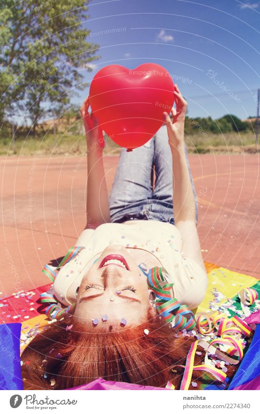 Young happy woman holding a heart shaped balloon Lifestyle Style Joy Hair and hairstyles Wellness Harmonious Well-being Relaxation Entertainment Party Event