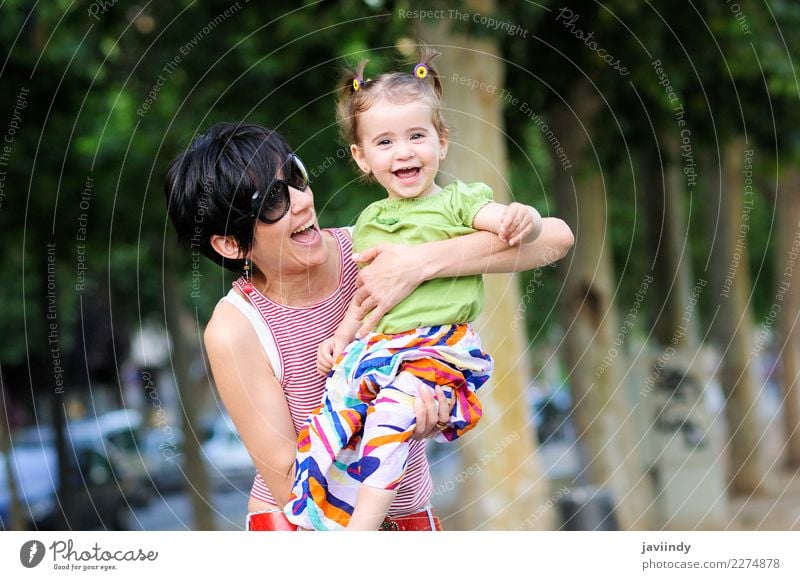 Mother and daughter laughing in the park Joy Life Parenting Child Human being Feminine Baby Toddler Girl Young woman Youth (Young adults) Woman Adults Parents