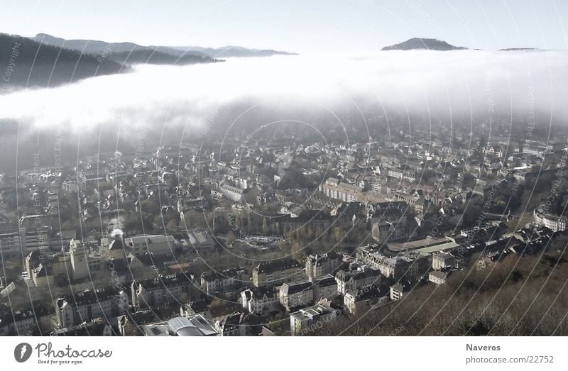 Freiburg swallowed up in the fog Clouds Autumn Weather Fog Small Town Outskirts Old town Populated House (Residential Structure) Building Threat Far-off places