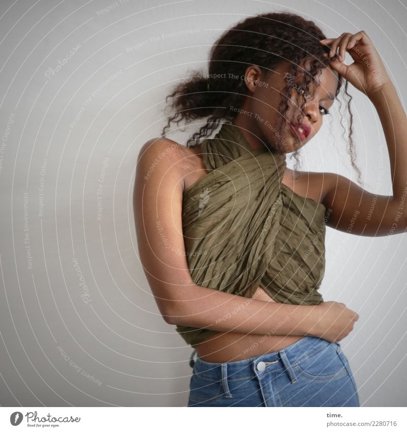 Woman with cloth Feminine Adults 1 Human being Jeans Cloth Hair and hairstyles Brunette Long-haired Curl Observe To hold on Looking Stand pretty Self-confident