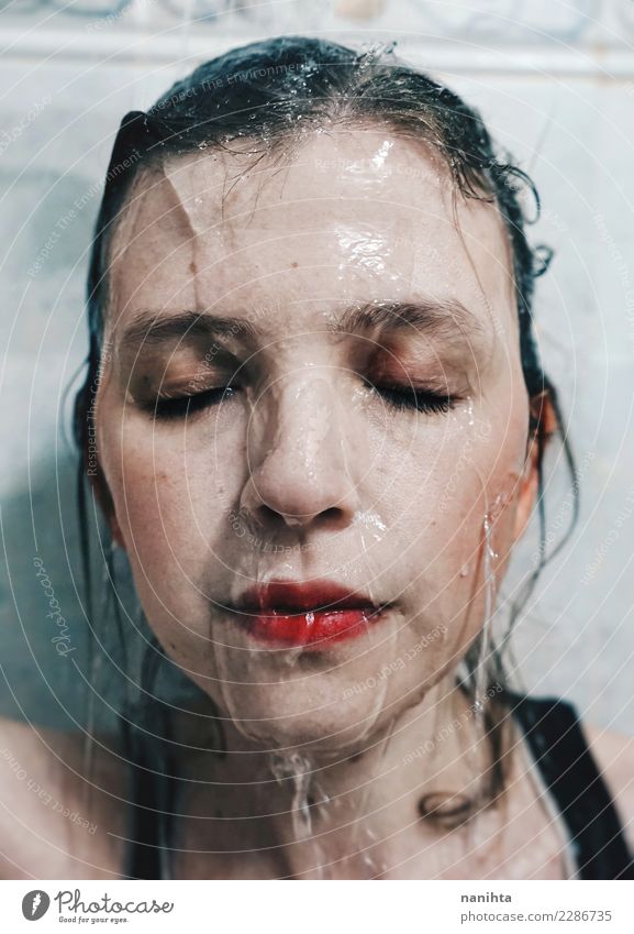 Portrait of a young woman with water running down her face Lifestyle Beautiful Personal hygiene Skin Face Senses Relaxation Spa Human being Feminine Young woman