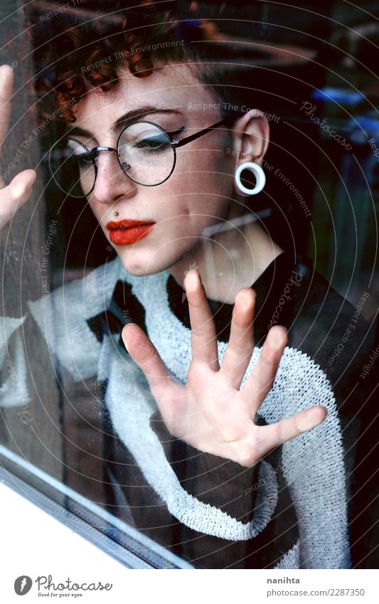 Young woman looking through a window Elegant Style Design Beautiful Hair and hairstyles Skin Face Lipstick Human being Feminine Youth (Young adults) 1