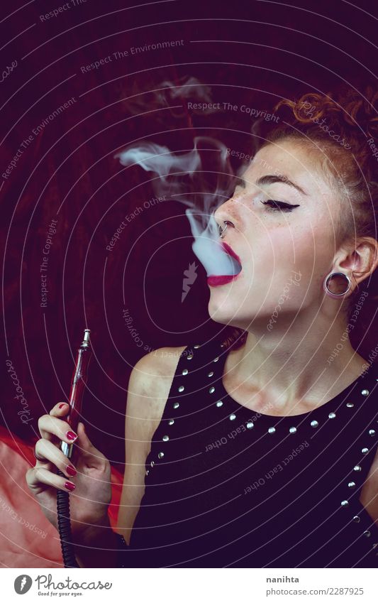 Young woman smoking shisha Lifestyle Elegant Style Exotic Beautiful Hair and hairstyles Skin Face Healthy Smoking Senses Going out Human being Feminine