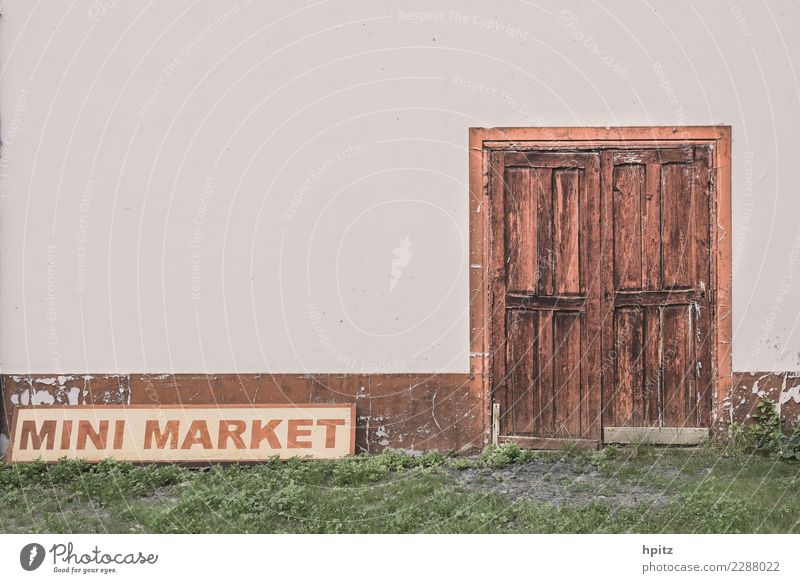 Mini Market Subculture Wall (barrier) Wall (building) Door Wood Signage Warning sign Graffiti Old Historic Broken Brown Gray Curiosity Concern Fatigue Longing