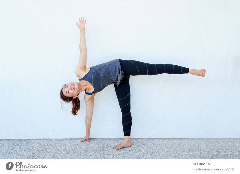 Yoga students showing different yoga poses. - a Royalty Free Stock Photo  from Photocase