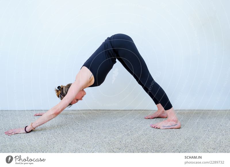 Yoga students showing different yoga poses. - a Royalty Free Stock Photo  from Photocase