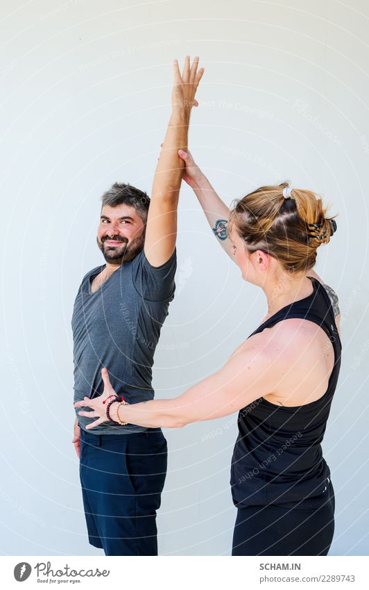 Yoga students showing different yoga poses. - a Royalty Free Stock Photo  from Photocase