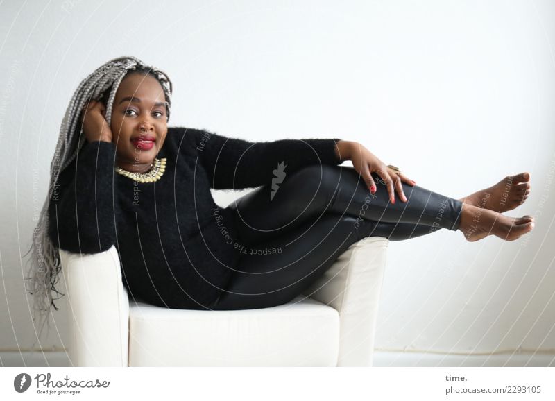 gené Armchair Room Feminine Woman Adults 1 Human being Pants Sweater Jewellery Barefoot Hair and hairstyles Black-haired Gray-haired Long-haired Braids Afro