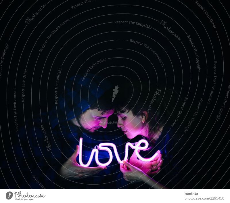 Young couple holding a neon light with love Style Design Face Human being Masculine Feminine Young woman Youth (Young adults) Young man Couple Partner 2