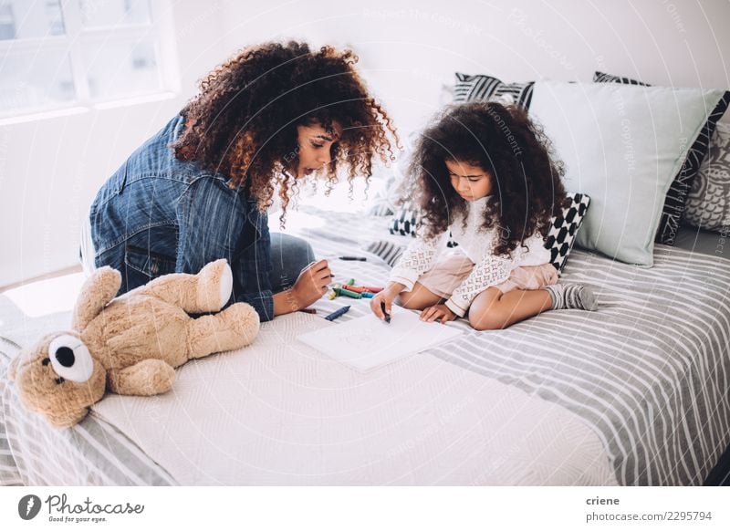 African american mother and daughter drawing together Happy Child Human being Woman Adults Parents Mother Family & Relations Infancy Art Paper Small Cute Black
