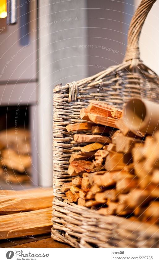 warmth Wood Brown Basket Firewood Fireside Colour photo Interior shot Deserted Copy Space left Copy Space top Blur Detail Stack of wood