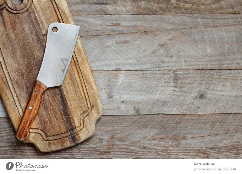 Old hatchet an a wooden cutting board, top view Desk Table Kitchen Dark Brown backdrop background cheeseboard chopping cooking empty food Plank Preparation