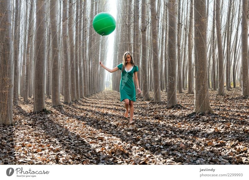 Young woman in poplar forest with green dress and balloon Lifestyle Joy Beautiful Relaxation Human being Feminine Youth (Young adults) Woman Adults 1