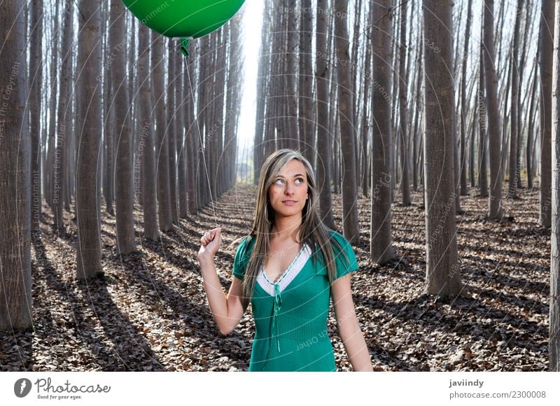 Blonde girl with green balloon and dress in the forest Lifestyle Joy Beautiful Relaxation Human being Young woman Youth (Young adults) Woman Adults 1