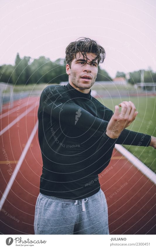 Young sports man stretching at running track Drinking water Lifestyle Joy Body Healthy Healthy Eating Health care Athletic Muscular Fitness Well-being