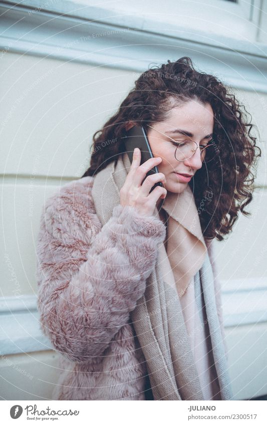 Young Woman is having a Conversation on phone outside Lifestyle Shopping Elegant Style Beautiful Leisure and hobbies Winter Winter vacation Human being Spring