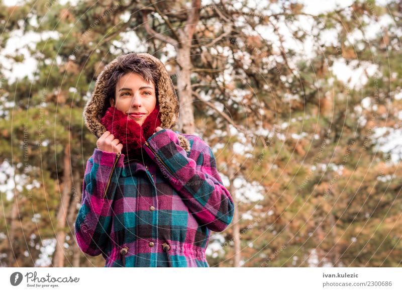 Cute brunette girl standing in park, wearing coat and scarf Lifestyle Elegant Style Happy Beautiful Face Winter Human being Woman Adults Nature Autumn Warmth