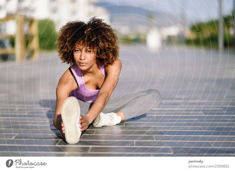 Black woman stretching after running outdoors Lifestyle Beautiful Hair and hairstyles Wellness Leisure and hobbies Sports Jogging Human being Young woman