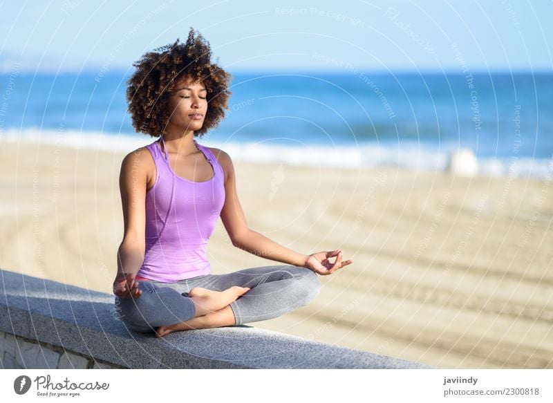 Young woman doing yoga in nature. Lotus figure. - a Royalty Free Stock  Photo from Photocase