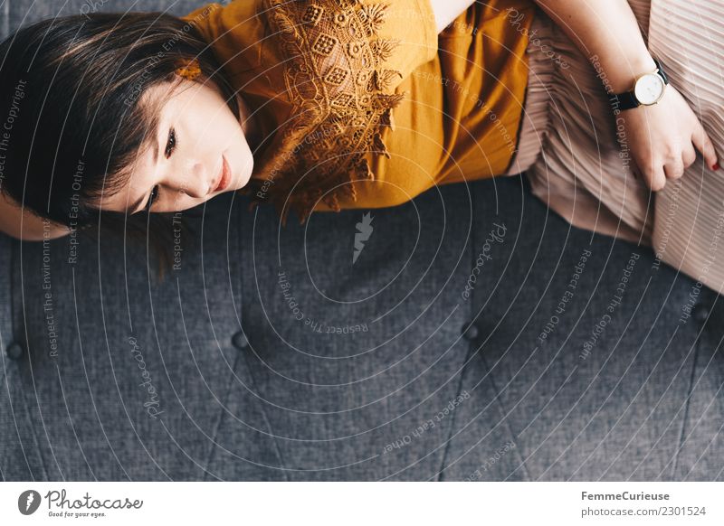 Young woman lying on the couch Feminine Youth (Young adults) Woman Adults 1 Human being 18 - 30 years Relaxation Serene Calm Living or residing Break Siesta