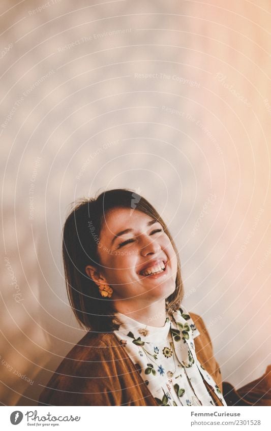 Young laughing woman in a room with play of light Lifestyle Elegant Style Feminine Young woman Youth (Young adults) Woman Adults 1 Human being 18 - 30 years