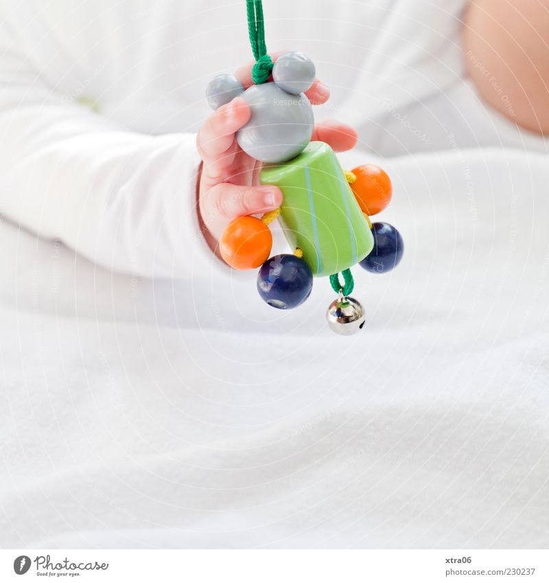 hand mouse game Human being Baby Girl Hand 1 0 - 12 months Cute Colour photo Copy Space bottom To hold on Grasp Wooden toy Fingers Small Delicate Bell Dexterity
