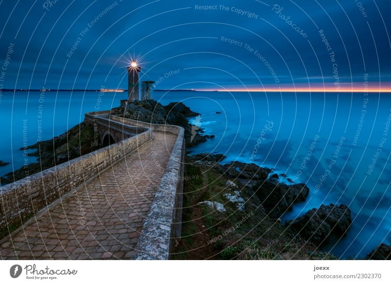 Stone path over bridge to lighthouse, washed by the sea at blue hour Lighthouse coast seascape Ocean Sky Waves France Brittany Phare du Petit Minou Horizon