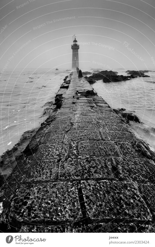 Behind the sea Sky Coast Saint-Nazaire France Lighthouse Lanes & trails Old Maritime Retro Black White Safety Protection Homesickness Wanderlust Hope Stone slab