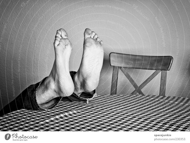 feet Masculine Man Adults Feet 1 Human being Lie Under Crazy Table Chair Dirty Whimsical Funny Black & white photo Interior shot Copy Space bottom