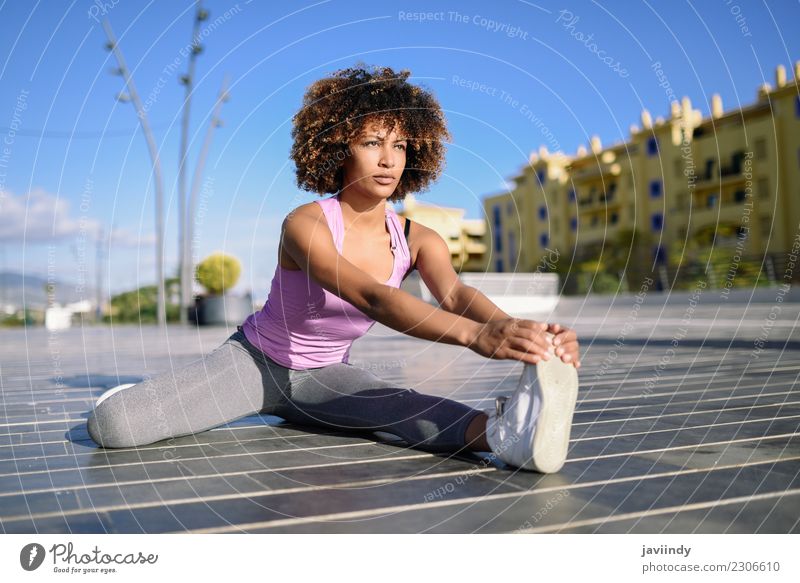 Young black woman doing stretching after running outdoors Lifestyle Beautiful Hair and hairstyles Wellness Leisure and hobbies Sports Human being Young woman