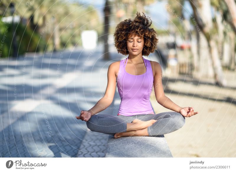 Black woman, afro hairstyle, doing yoga in the beach with eyes closed Lifestyle Beautiful Body Hair and hairstyles Wellness Relaxation Meditation