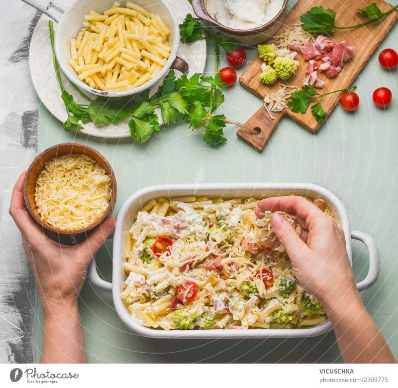Female hands make pasta gratin Food Nutrition Lunch Dinner Organic produce Crockery Style Design Living or residing Table Kitchen Feminine Hand Yellow Macaroni
