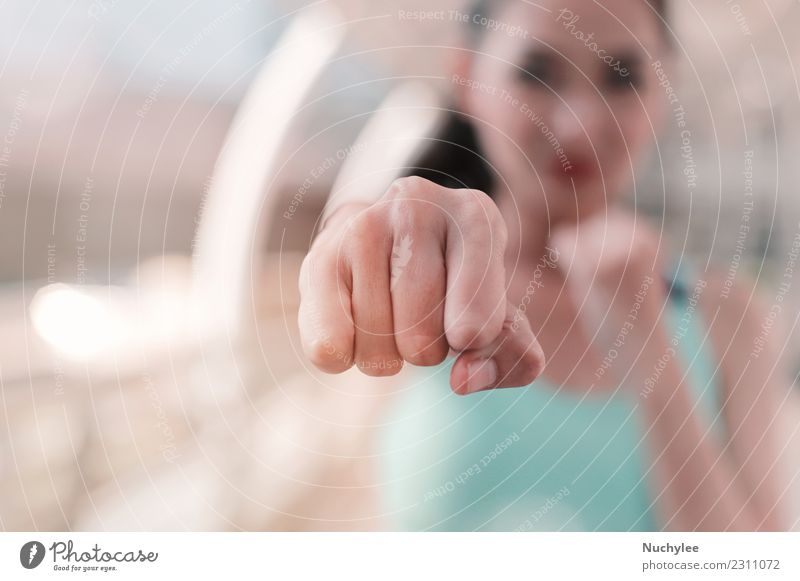 Woman clenched fist ready to punch close up Lifestyle Style Body Face Sports Martial arts Human being Adults Hand Fitness Athletic Strong Anger White Power