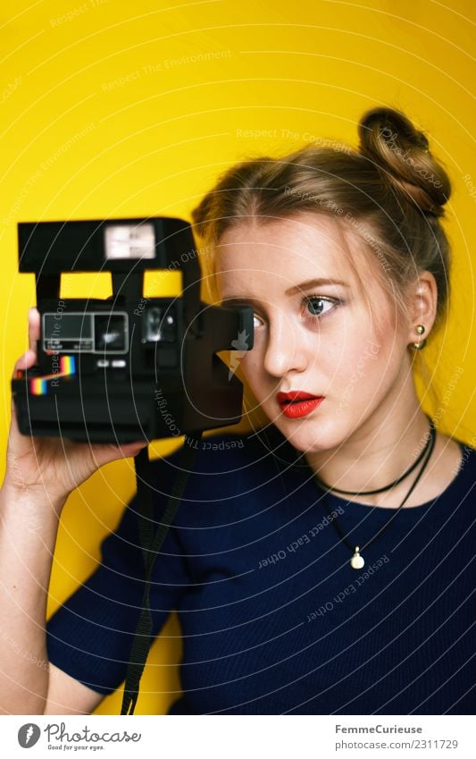 Young woman taking pictures with an instant camera Lifestyle Elegant Style Feminine Youth (Young adults) Woman Adults 1 Human being 18 - 30 years Creativity