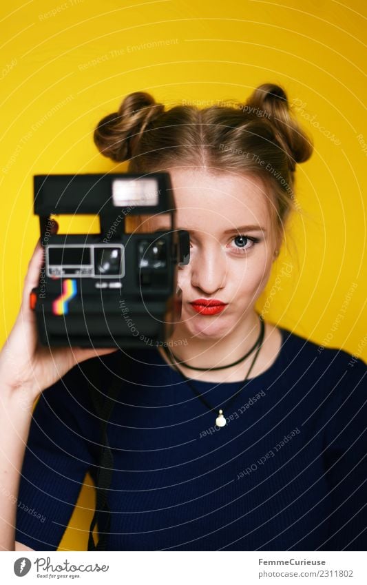 Young woman with an instant camera Lifestyle Style Feminine Youth (Young adults) Woman Adults 1 Human being 18 - 30 years Creativity Beautiful Photography
