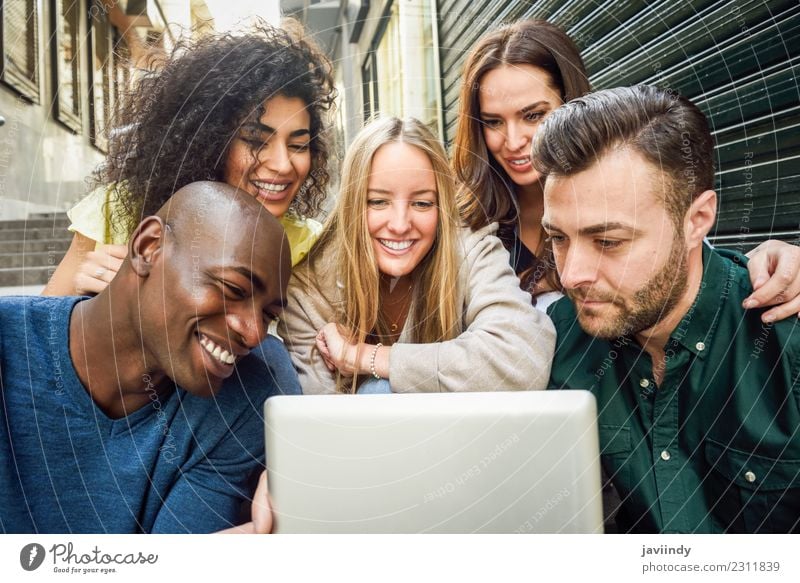 Young people looking at a tablet computer outdoors Lifestyle Joy Happy Beautiful Human being Young woman Youth (Young adults) Young man Woman Adults Man