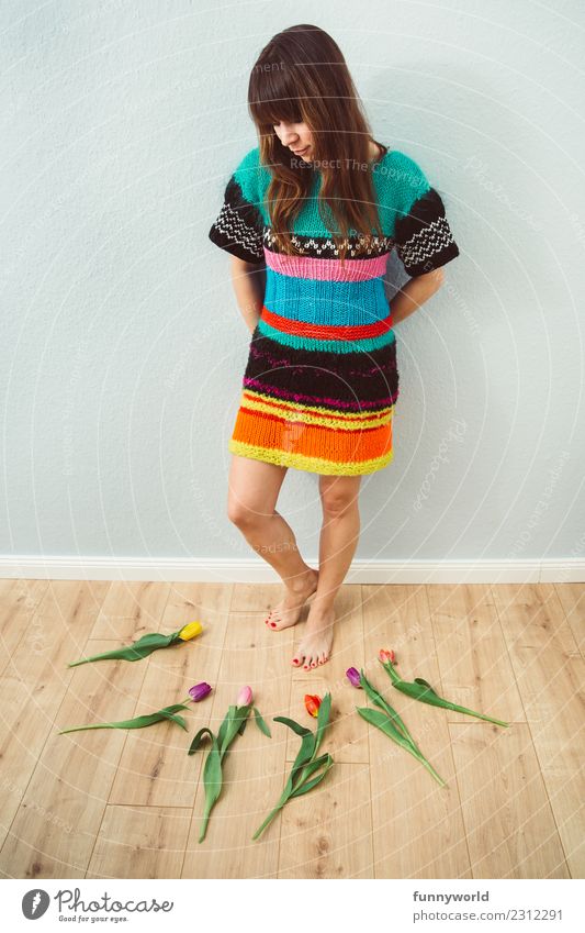 Woman looking at tulips on the floor Human being Feminine Adults 1 Brunette Bangs Stand Exceptional Fresh Orderliness Inspiration Creativity Spring Tulip Lie