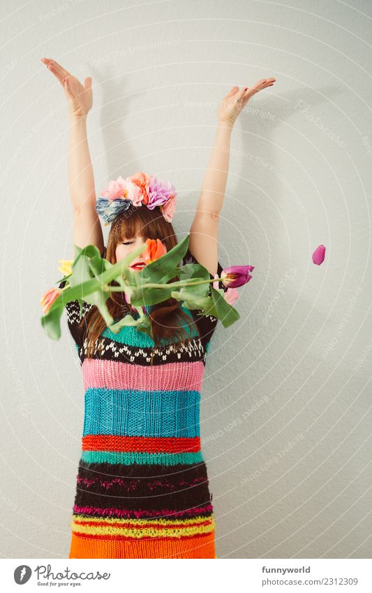 Tulips fall in front of woman Human being Feminine Woman Adults 1 Blossoming Throw Spring fever To fall Headdress Arm Tall Hand Desire Hope Wool Dress Hippie