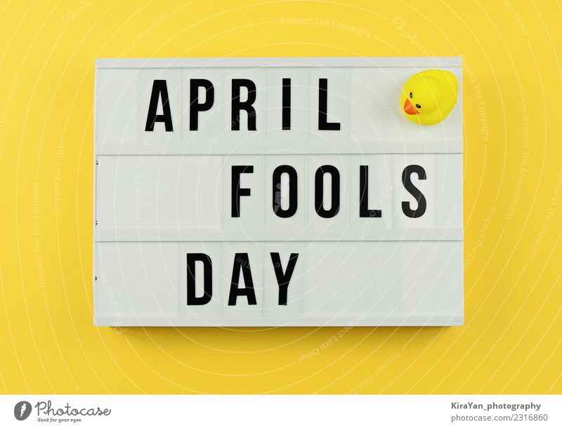 Text April Fool's day in light box on yellow Joy Entertainment Feasts & Celebrations Spring Toys Box Smiling Laughter Funny Yellow Moody Optimism Friendship