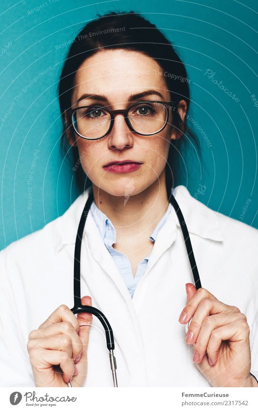 Female doctor with stethoscope and lab coat Work and employment Profession Doctor Feminine Young woman Youth (Young adults) Woman Adults 1 Human being