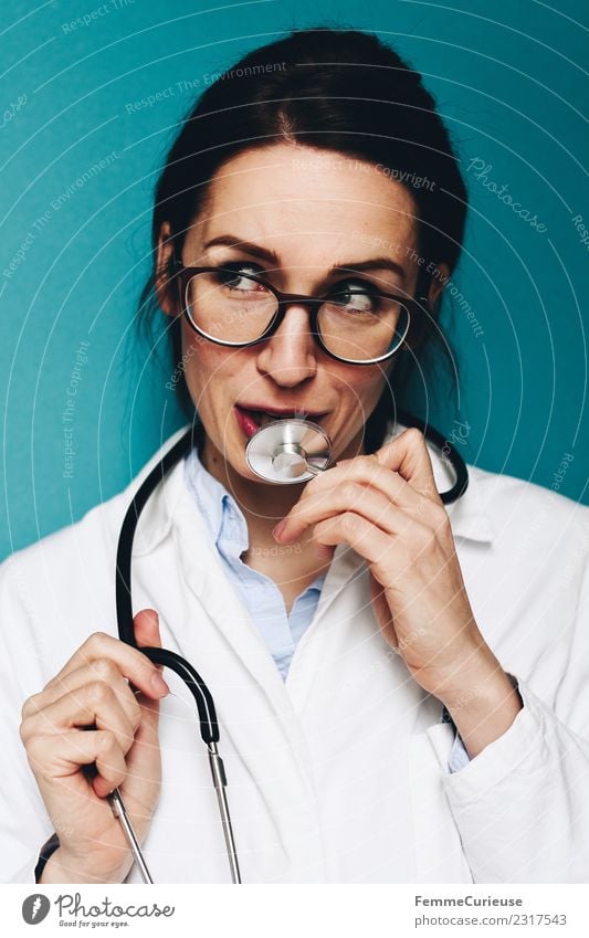 Female, friendly doctor fooling around with her stethoscope Work and employment Profession Doctor Feminine Young woman Youth (Young adults) Woman Adults 1